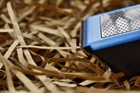hair cutter on a light straw background