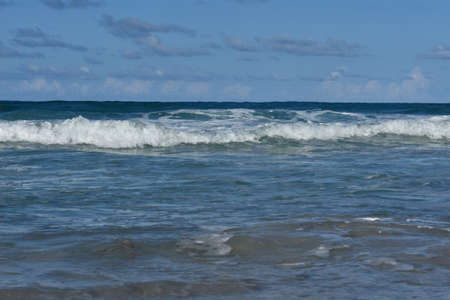 white waves on the blue ocean water