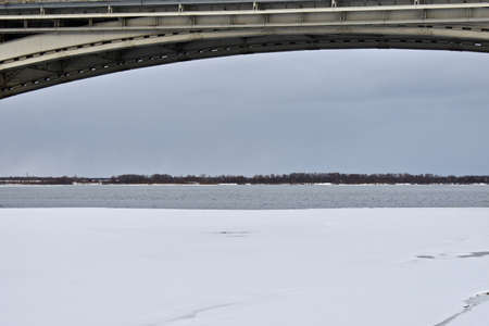 road bridge over the river in winterの写真素材