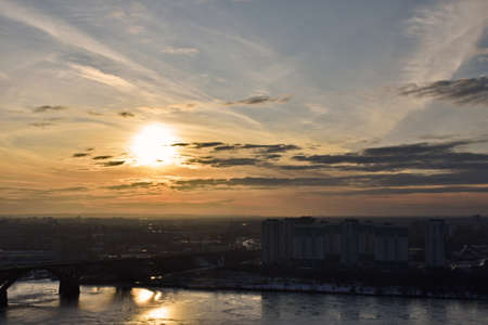 sunset over a road bridge over the river