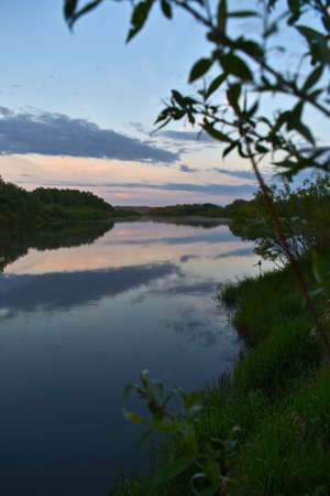 colorful and misty dawn over a small river