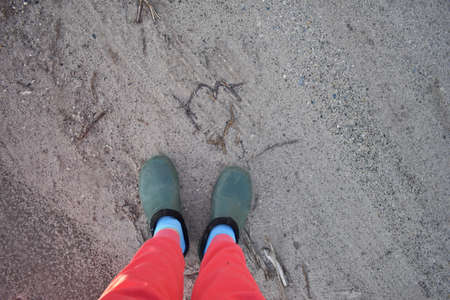 feet in pink pants and boots