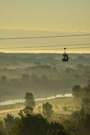 dawn over the cable car across the riverの写真素材