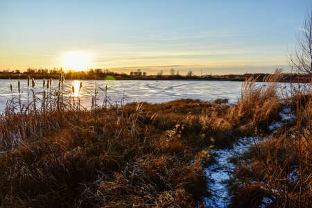 the first ice on the sun at sunsetの写真素材