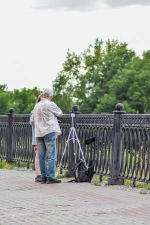 Photographer works on the streetの写真素材