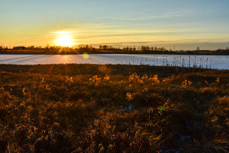 the first ice on the sun at sunsetの写真素材