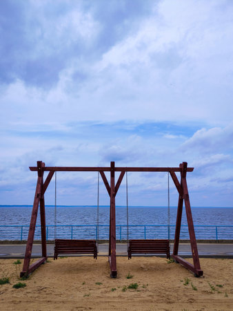 wooden swing with sea viewの写真素材