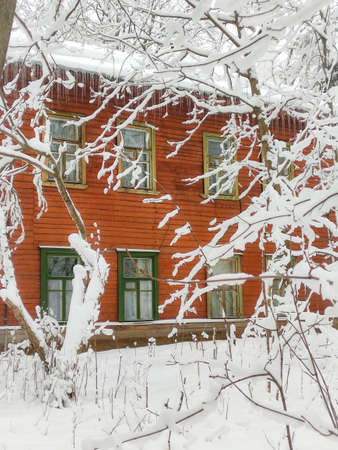 beautiful wooden houses in a winter townの写真素材