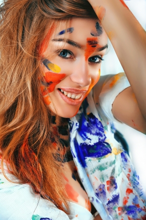 Portrait of a beautiful girl covered in paint の写真素材