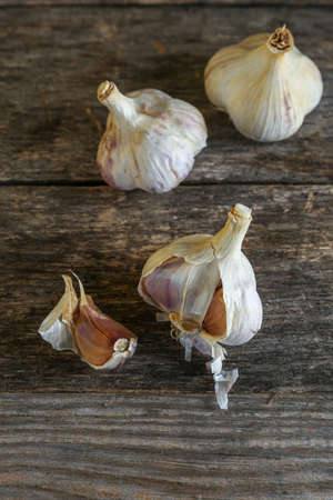 Garlic on an old wooden tableの写真素材