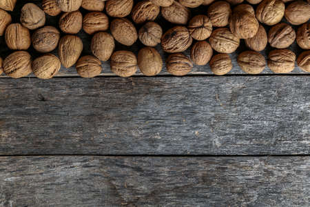 Walnuts on an old wooden tableの写真素材
