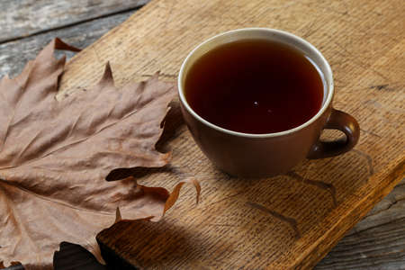 Cup of tea on an old wooden tableの写真素材