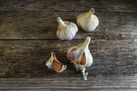 Garlic on an old wooden tableの写真素材