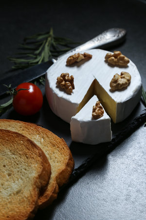 Still life with cheese on a dark backgroundの写真素材