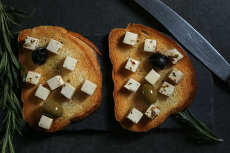 Still life with cheese on a dark background