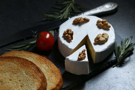 Still life with cheese on a dark backgroundの写真素材