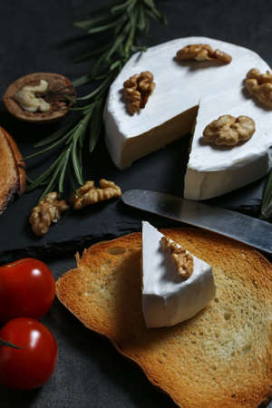 Still life with cheese on a dark backgroundの写真素材