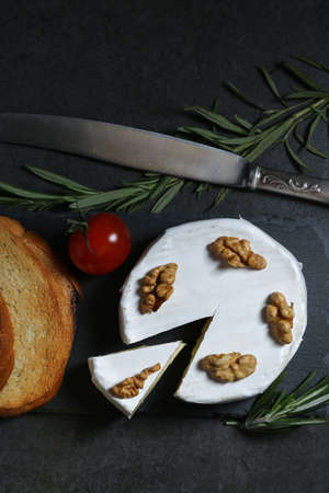 Still life with cheese on a dark backgroundの写真素材