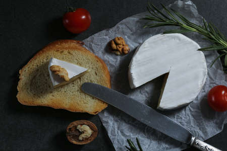 Still life with cheese on a dark backgroundの写真素材
