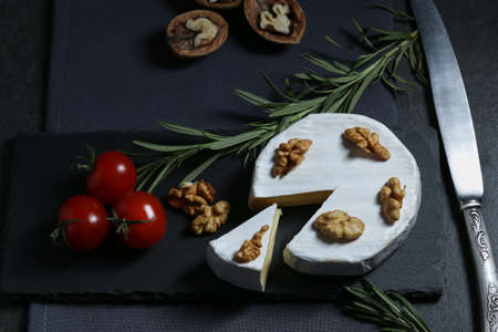 Still life with cheese on a dark backgroundの写真素材