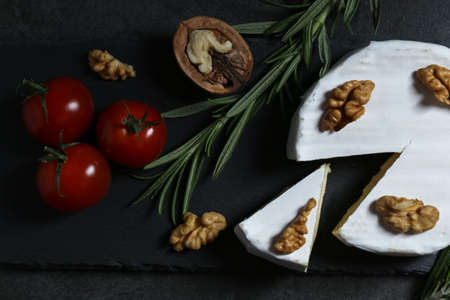 Still life with cheese on a dark backgroundの写真素材