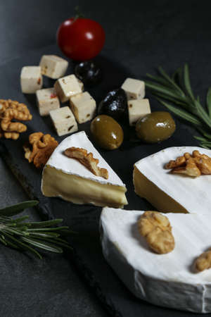 Still life with cheese on a dark backgroundの写真素材