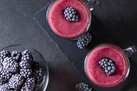 Frozen banana and blackberry smoothie. A healthy drink without sugar. Nice cooling on a hot day.の写真素材