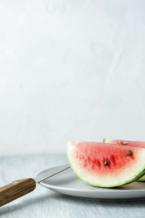 Sliced watermelon, honey watermelon on wooden table background. Very healthy, natural, vegetarian...
