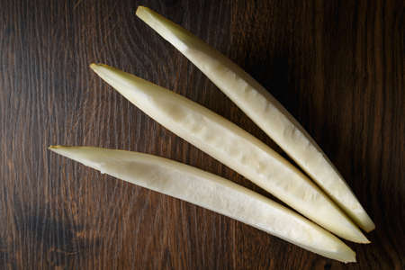 Sliced melon, honey melon on wooden table background. Very healthy, natural, vegetarian food.の写真素材