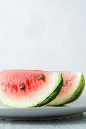 Sliced watermelon, honey watermelon on wooden table background. Very healthy, natural, vegetarian...