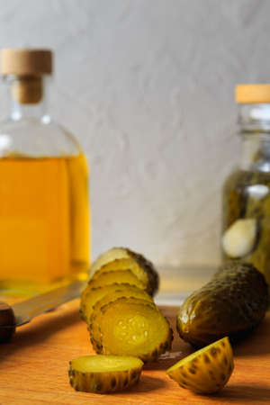 Pickled cucumbers in a jar with herbs and spices. Sliced pickled cucumber. Healthy fermented food.の写真素材