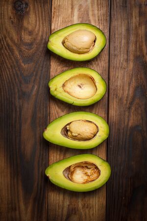Sliced avocado on a wooden table