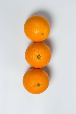 Sweet ripe orange on a white backgroundの写真素材