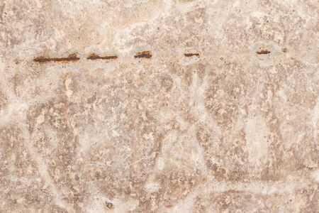 Scary beige wall texture with scratches and cracks.の写真素材