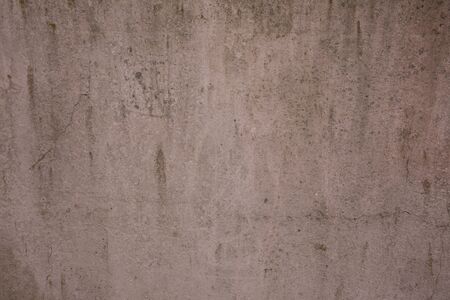 Scary beige wall texture with scratches and cracks.の写真素材