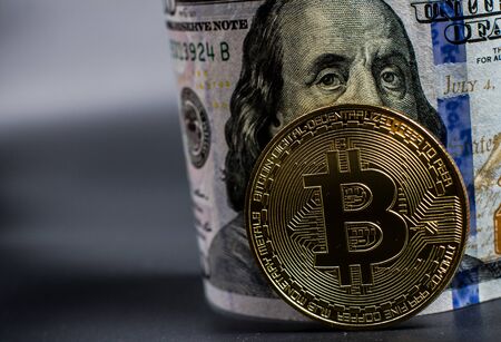 Bitcoin gold coin and dollar billの写真素材