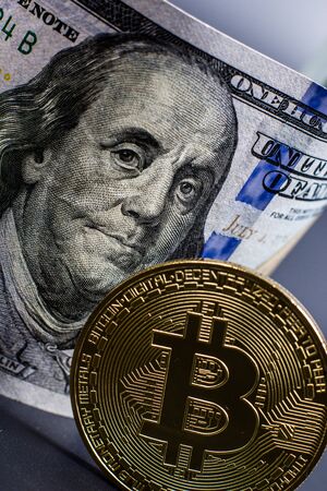 Bitcoin gold coin and dollar billの写真素材