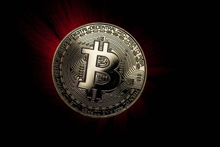 Backlit Bitcoin Coinの写真素材