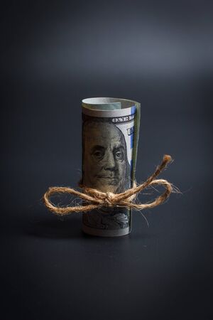 Dollar tied with a ropeの写真素材