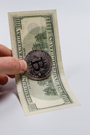 Bitcoin coin and dollar billsの写真素材