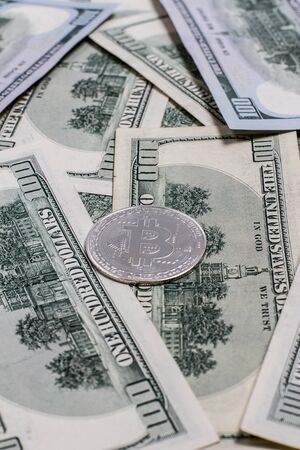 Bitcoin coin and dollar billsの写真素材