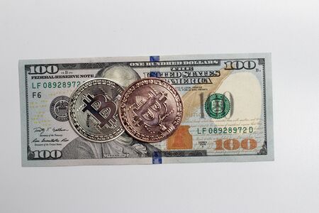 Bitcoin coin and dollar billsの写真素材