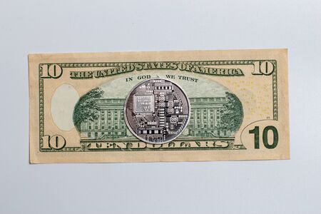 Bitcoin coin on a banknoteの写真素材