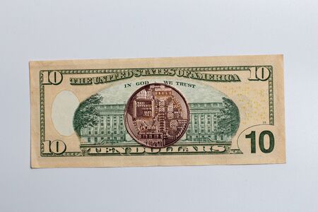 Bitcoin coin on a banknoteの写真素材