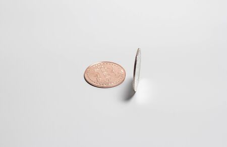 Two bitcoins on a white backgroundの写真素材