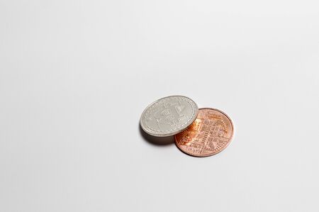Two bitcoins on a white backgroundの写真素材