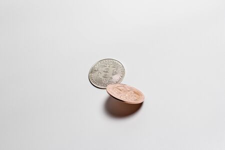 Two bitcoins on a white background