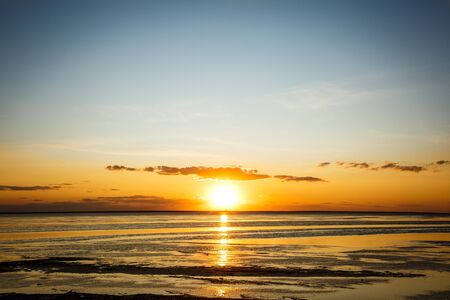 Beautiful sunrise by the seaの写真素材