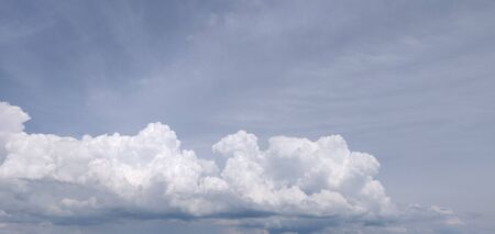 Beautiful volumetric clouds in the blue skyの写真素材
