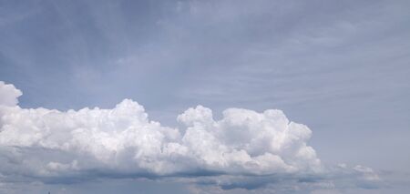 Beautiful volumetric clouds in the blue skyの写真素材